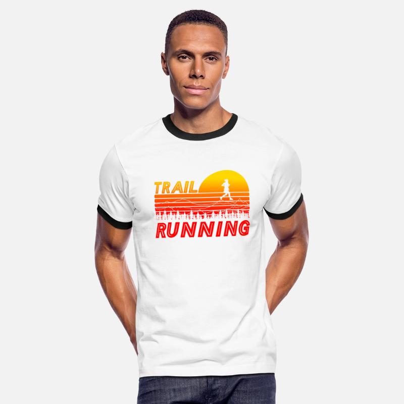Trail running in orange sunset with mountains